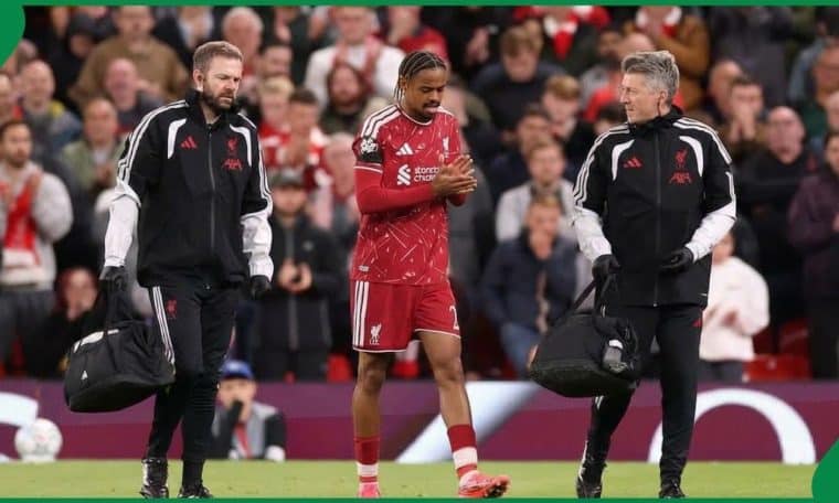 Liverpool's medical team escorting Bradley Barcola off the pitch after sustaining an injury in the clash against Atletico Madrid.