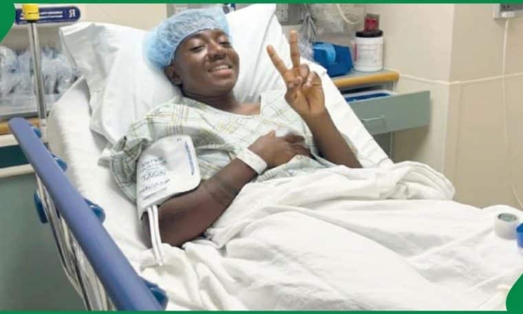 Super Falcons midfielder Deborah Abiodun in an hospital bed after successfully undergoing surgery.