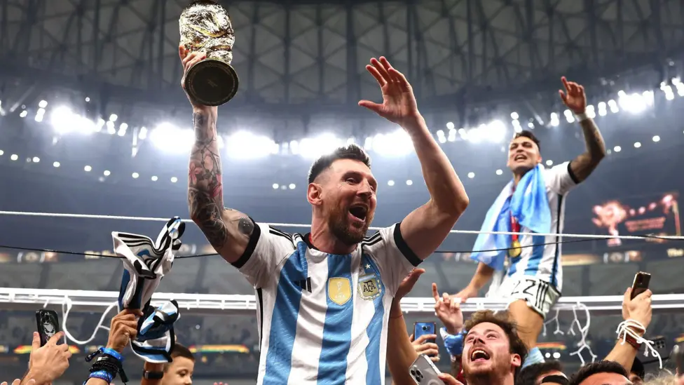 Lionel Messi celebrates the 2022 FIFA World Cup triumph with his teammates.