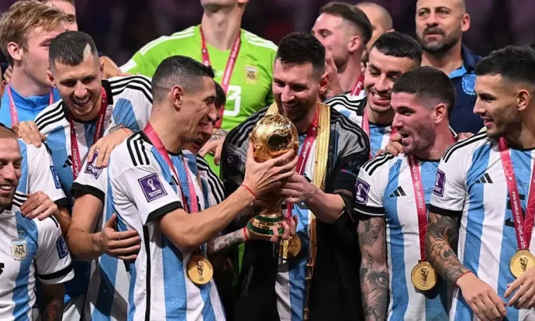 Lionel Messi celebrates the 2022 FIFA World Cup triumph with his teammates.