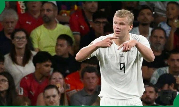 Erling Haaland signalling to the bench that he wants to be substituted during a UEFA Nations League game.