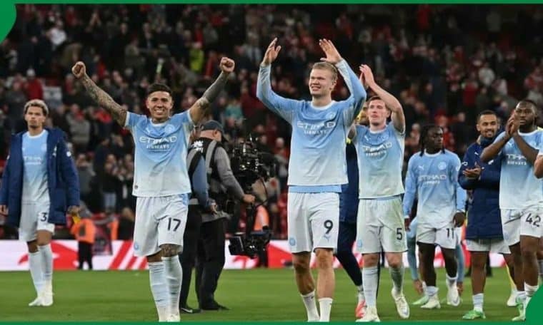Manchester City players celebrate after their 3-0 win over Liverpool.