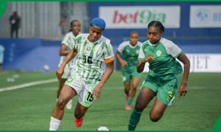 Super Eagles captain, Rasheedat Ajibade taking on a Comoros player.