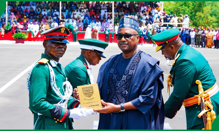 Adeshina receiving his award from Tajudeen Abbas, speaker of the house of representatives