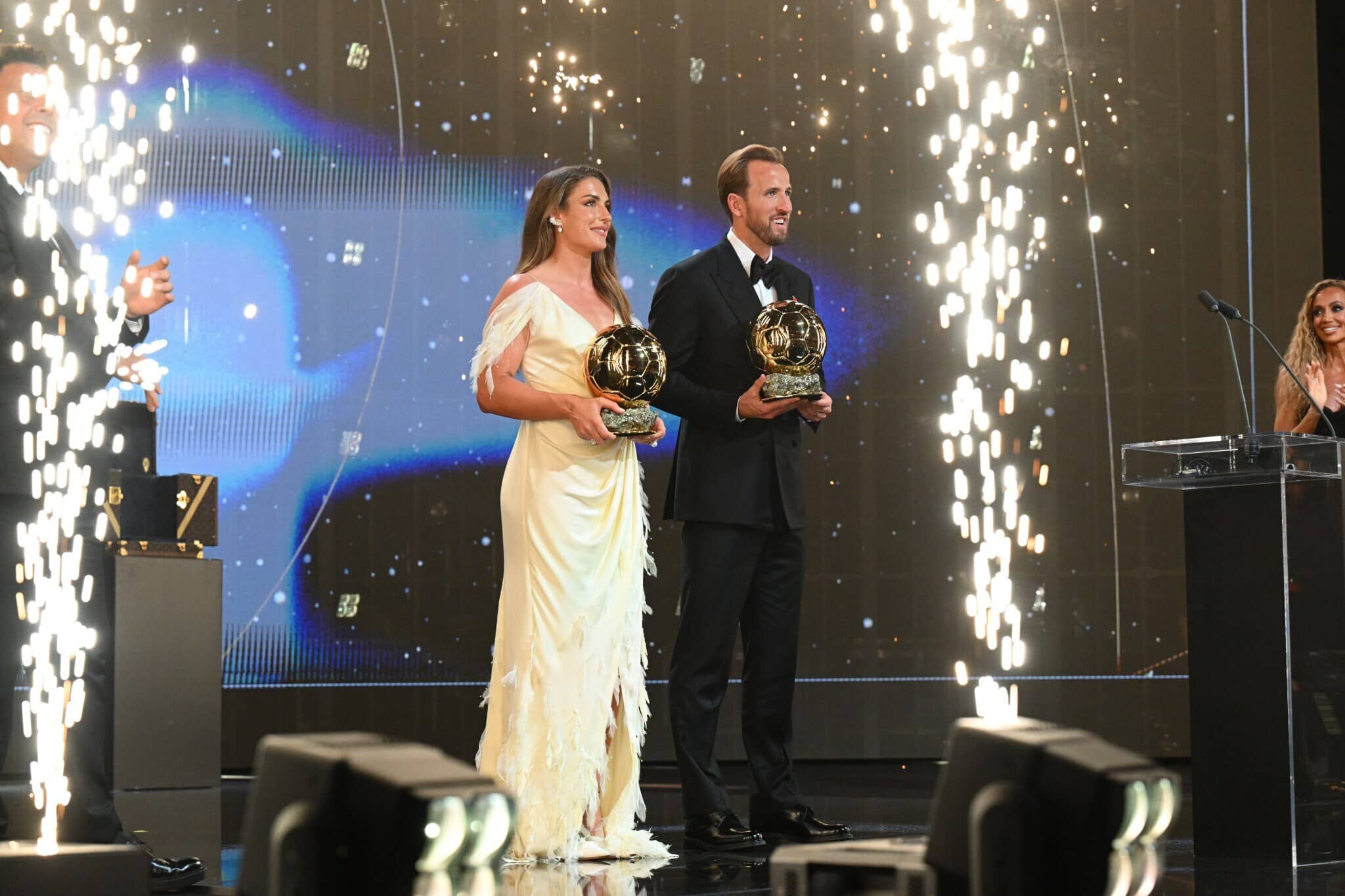 Alexia Putellas and Harry Kane posing with the 2026 Ballon d'Or