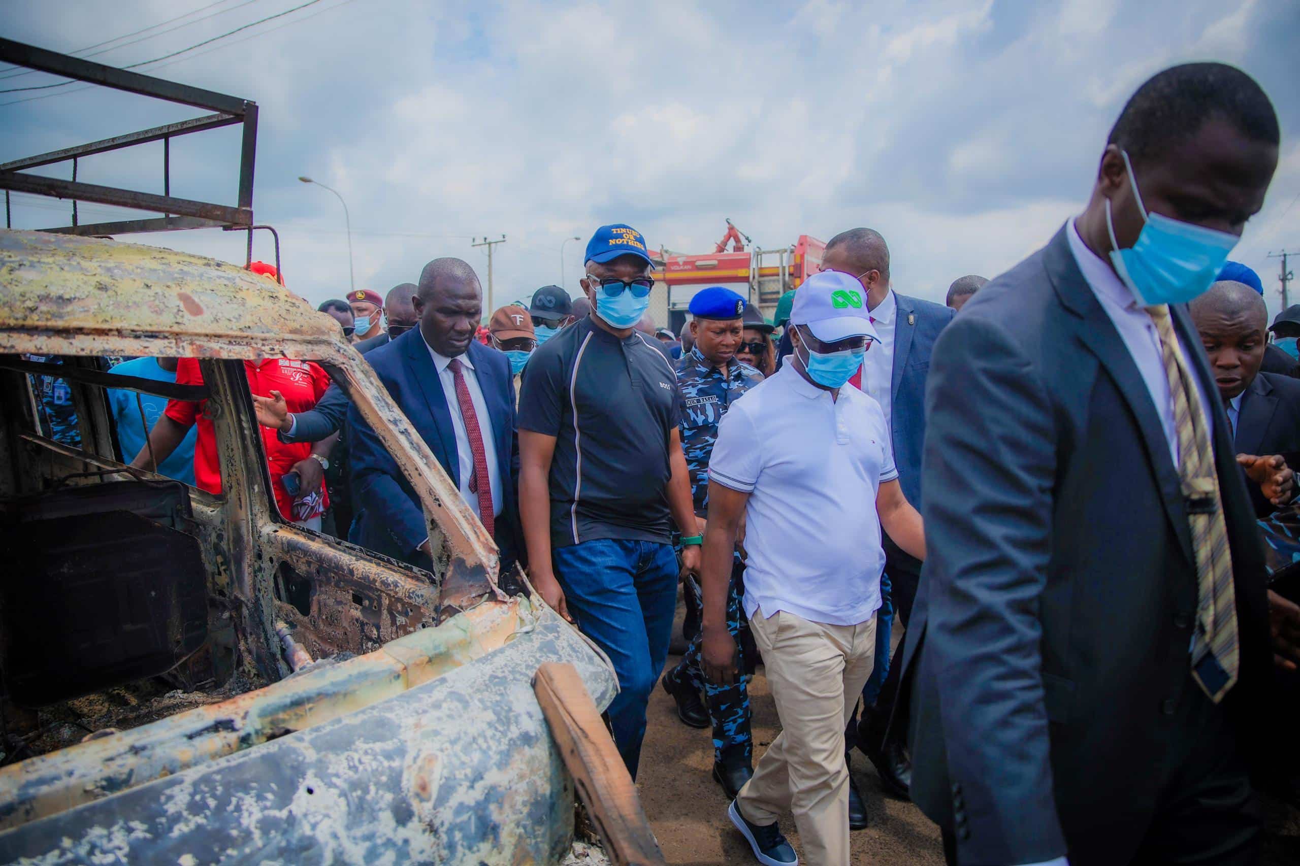 Edo State Governor Monday Okpebholo and his entourage during his visit to the scene of the fire outbreak.